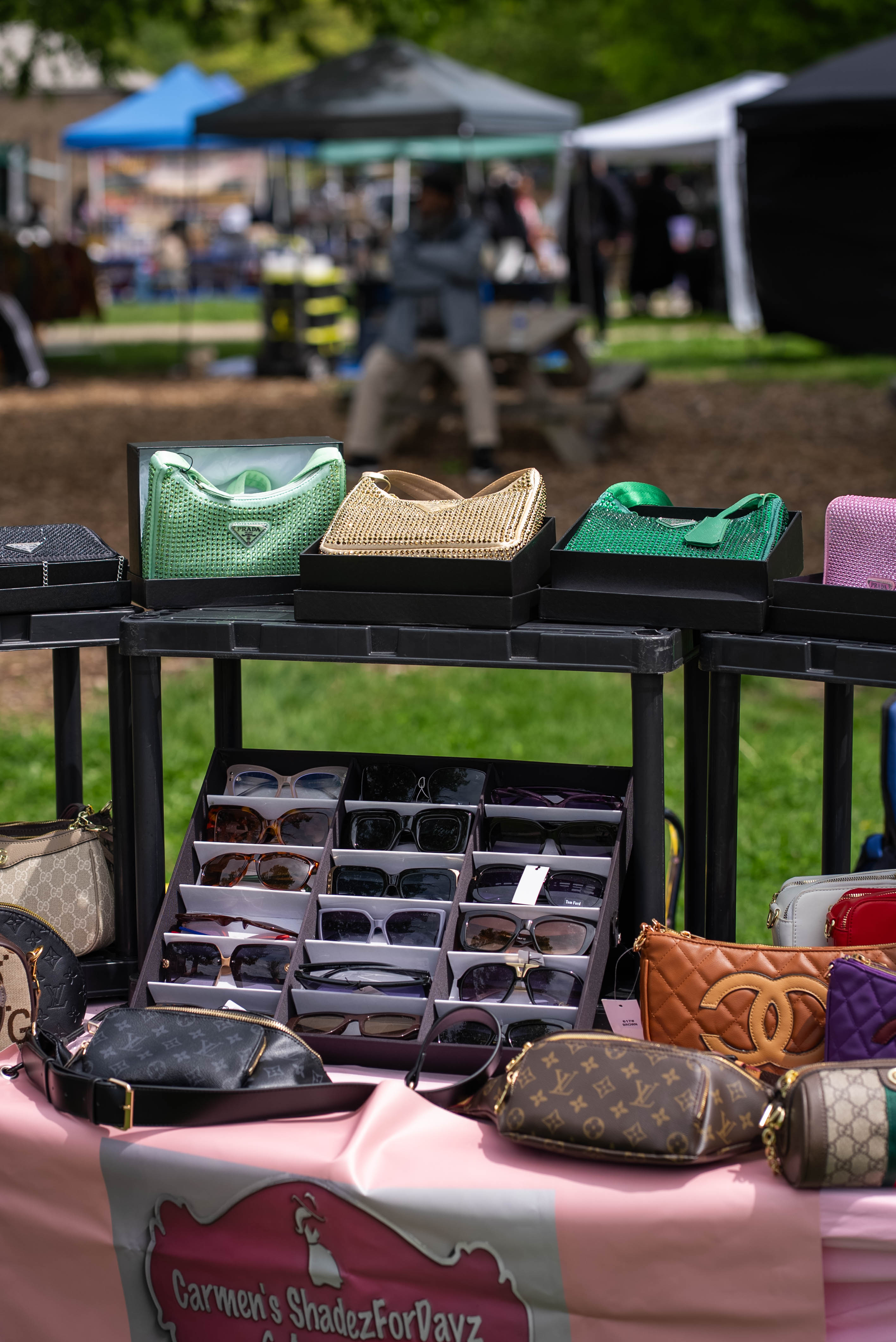 Accessories and sunglasses displayed at an outdoor vendor table