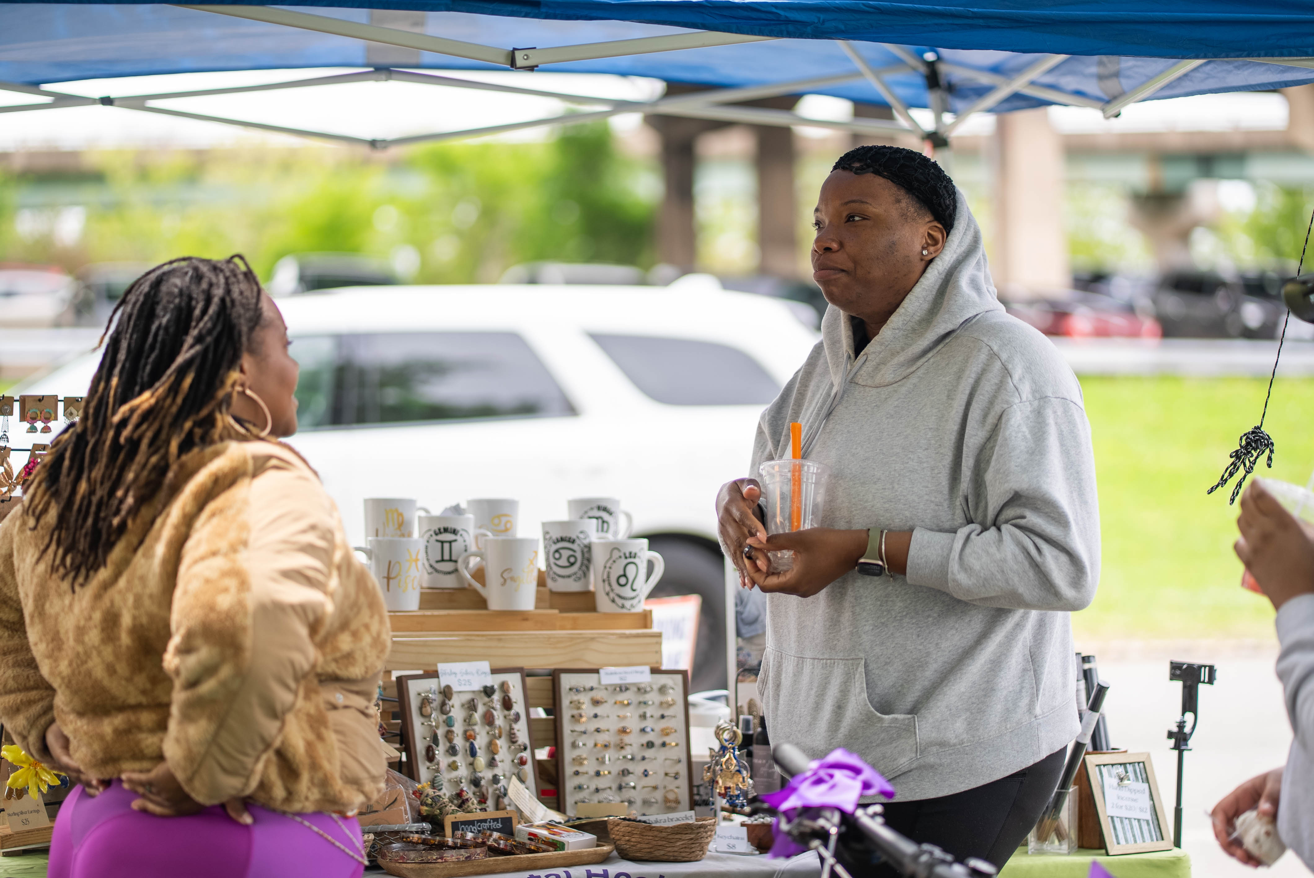 Vendor speaking with a customer at the market